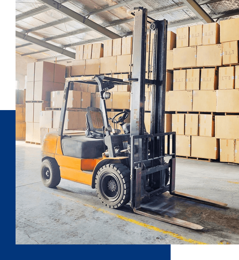 A forklift is parked in front of boxes.